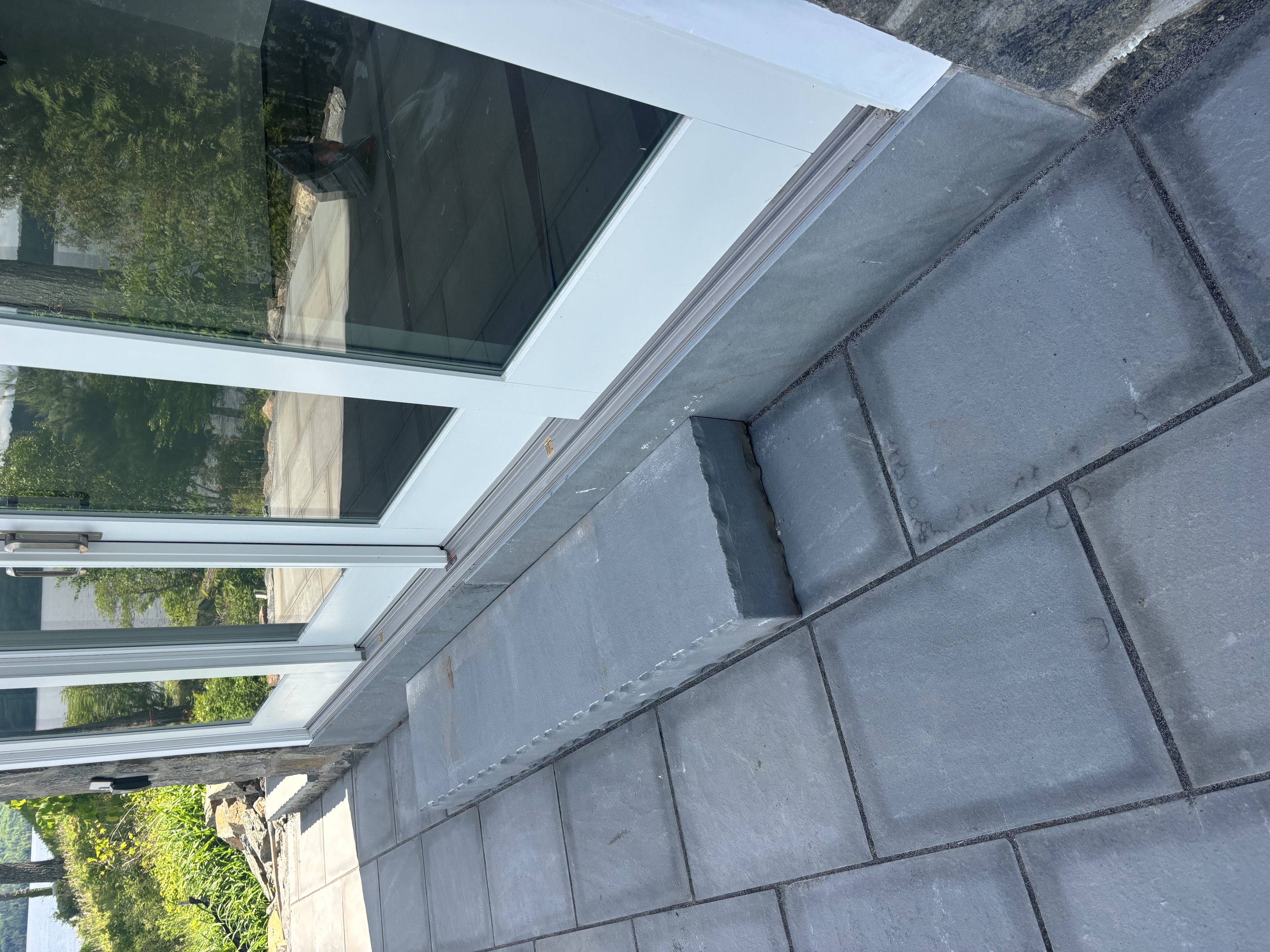 Bluestone patio and steps at lakefront home